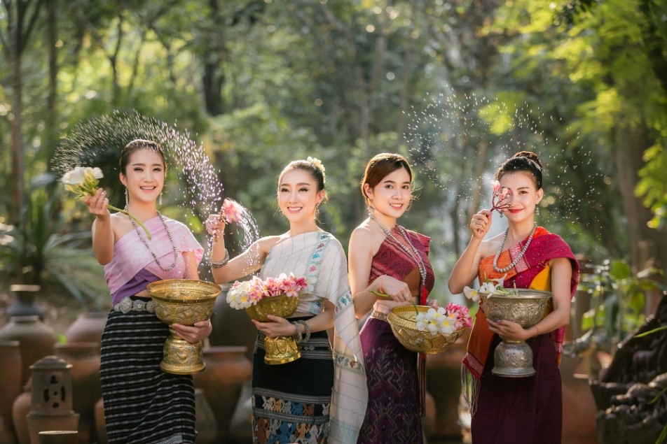 Thai girls splashing water during festival Songkran festival